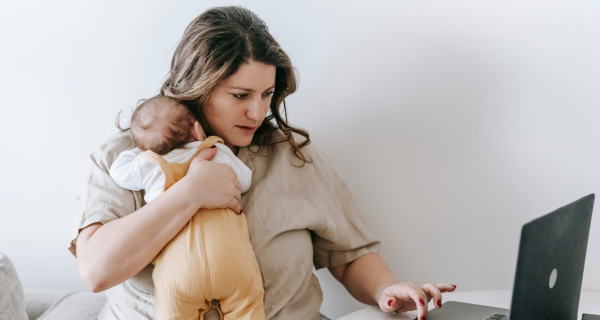 Busy mom working with baby